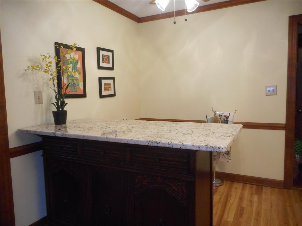 8709 Campfire Trail Raleigh, NC 27615 - Photo 5 of 25 a bathroom with a granite countertop sink and a mirror