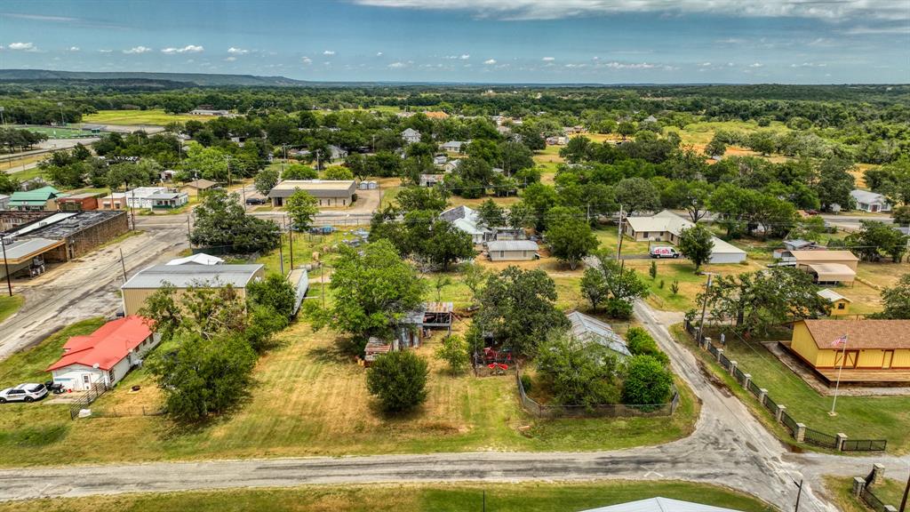 62 Travis Street Santo, TX 76472 - Photo 5 of 9 an aerial view of residential houses with outdoor space