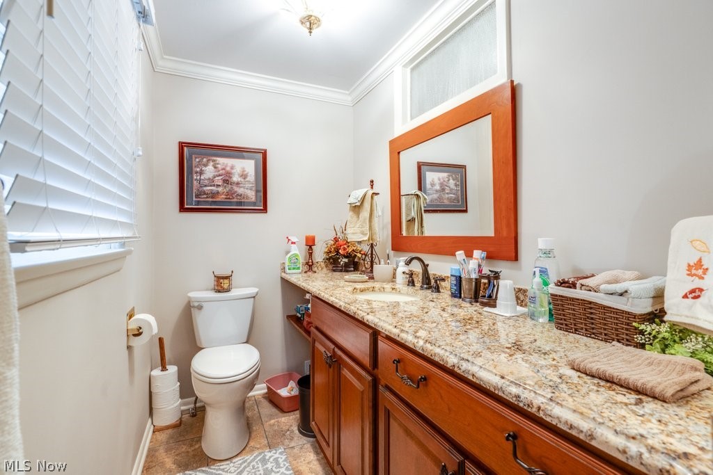 5981 Wiclif Road Northeast Canton, OH 44721 - Photo 35 of 50 Half bathroom featuring vanity and crown molding