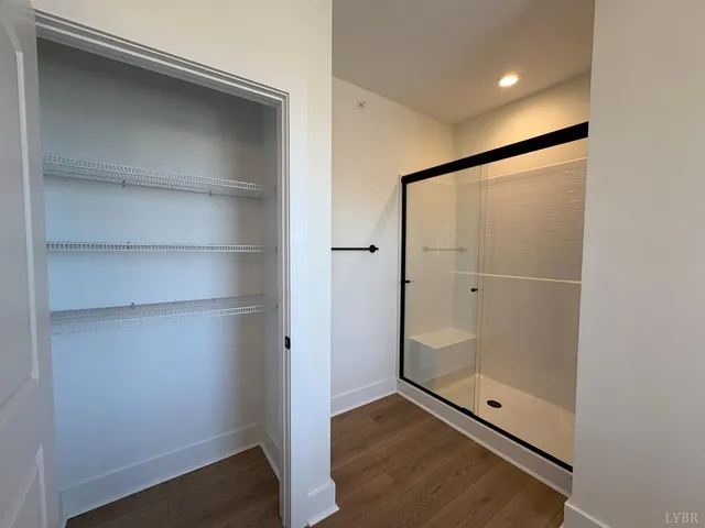 a bathroom with a glass shower door