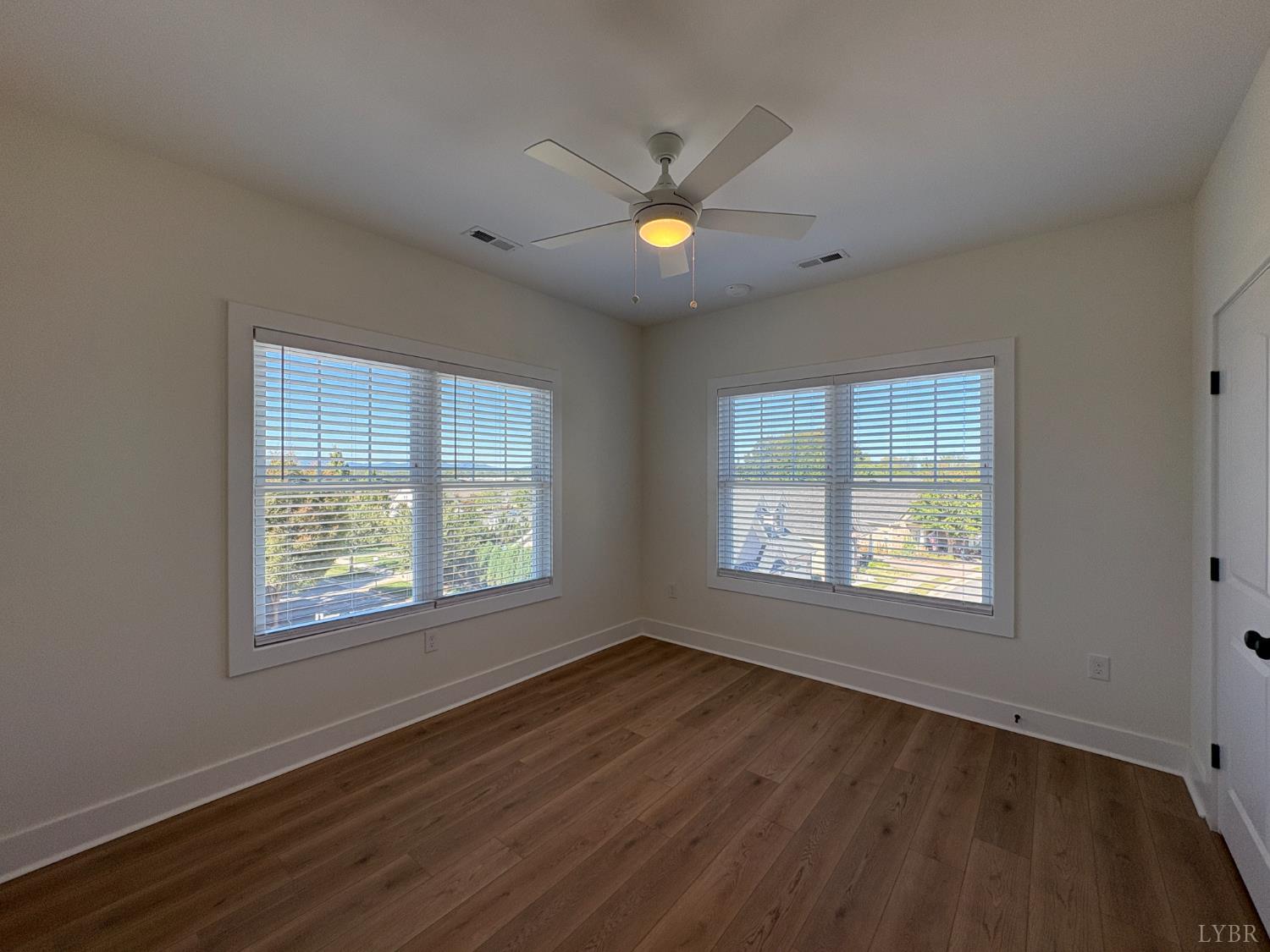 420 Capstone Drive, Unit 306 Lynchburg, VA 24502 - Photo 23 of 37 a view of an empty room with wooden floor and a window