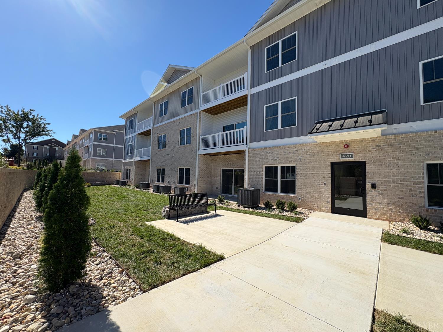 420 Capstone Drive, Unit 306 Lynchburg, VA 24502 - Photo 29 of 37 a view of a building with a yard