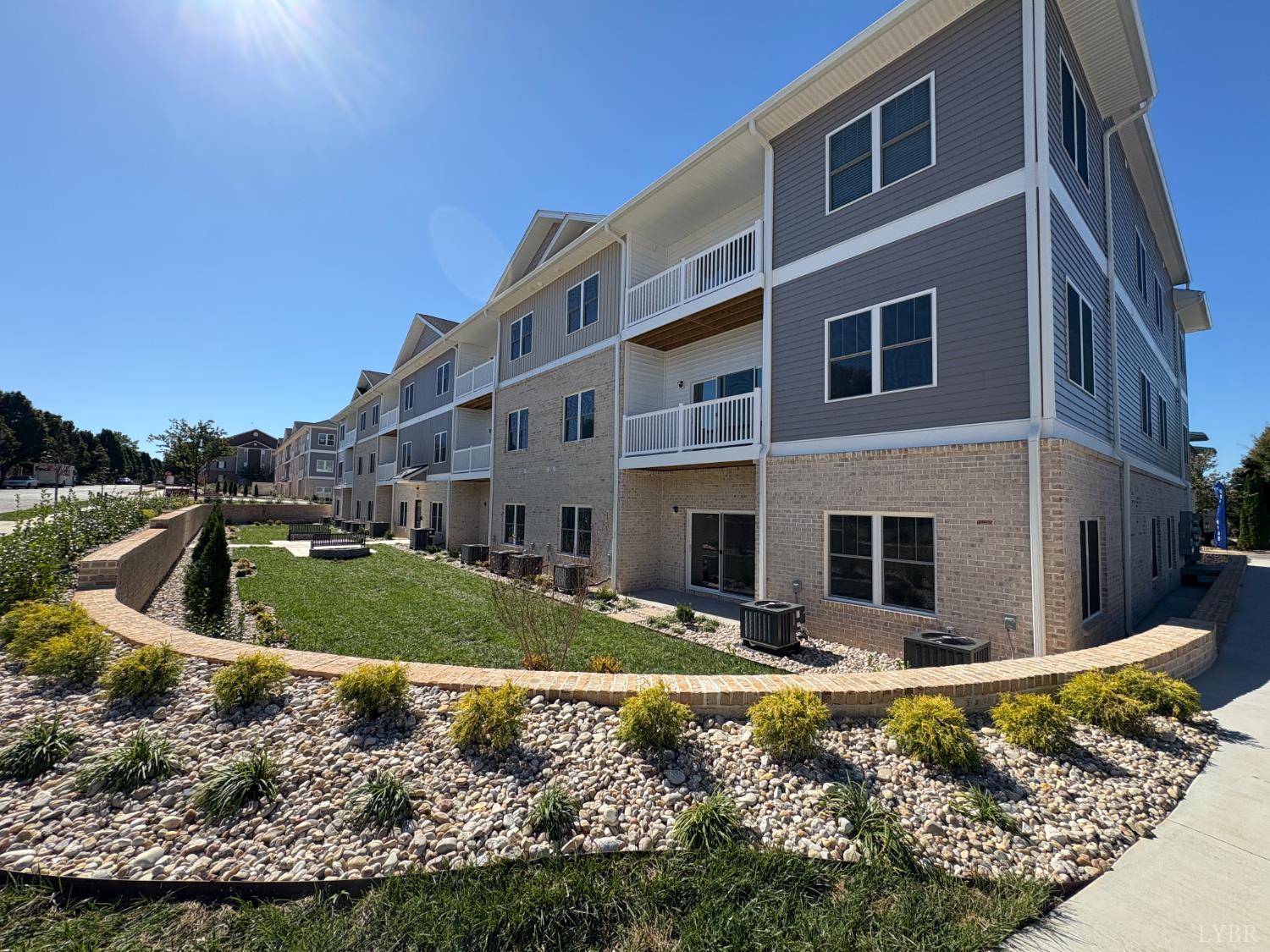 420 Capstone Drive, Unit 306 Lynchburg, VA 24502 - Photo 31 of 37 a view of a house with pool yard and a fire pit
