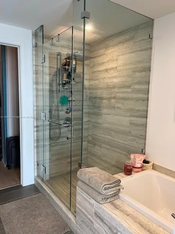 a bathroom with a sink and a shower