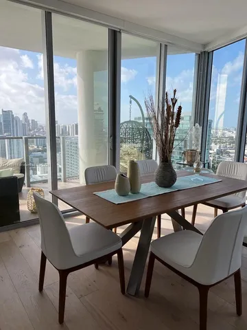 a view of a dining room with furniture window and outside view