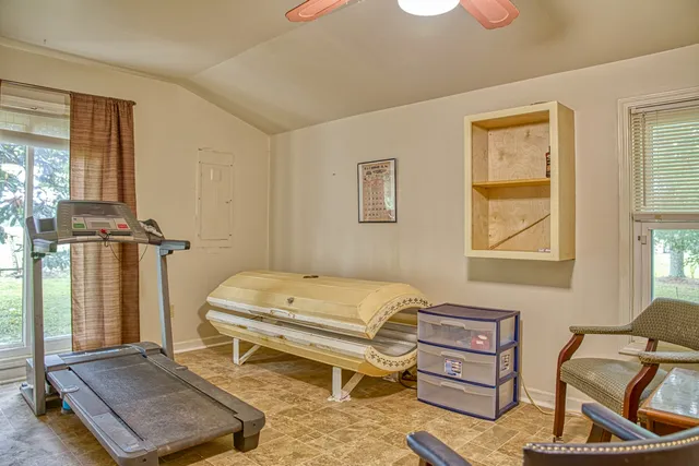 a living room with furniture and a window