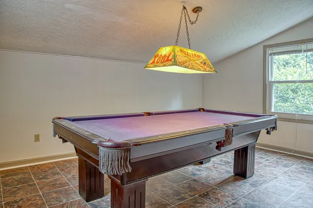 a view of a chairs and table in a patio
