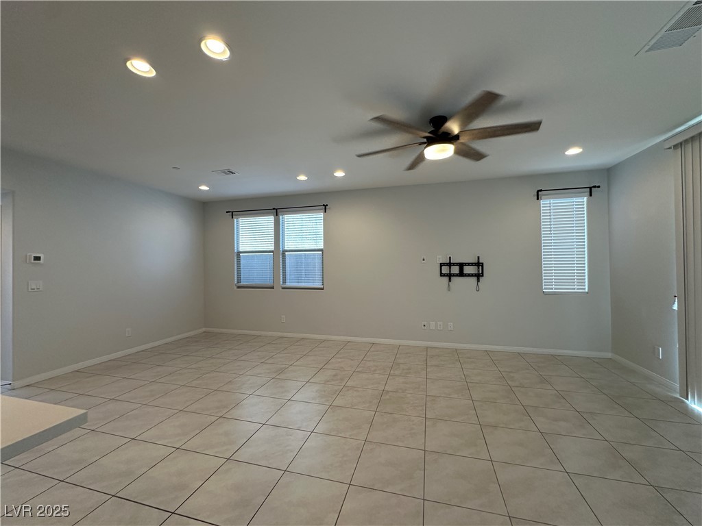 11585 Salt Creek Avenue Las Vegas, NV 89138 - Photo 11 of 45 Empty room featuring recessed lighting, light tile patterned floors, and a ceiling fan
