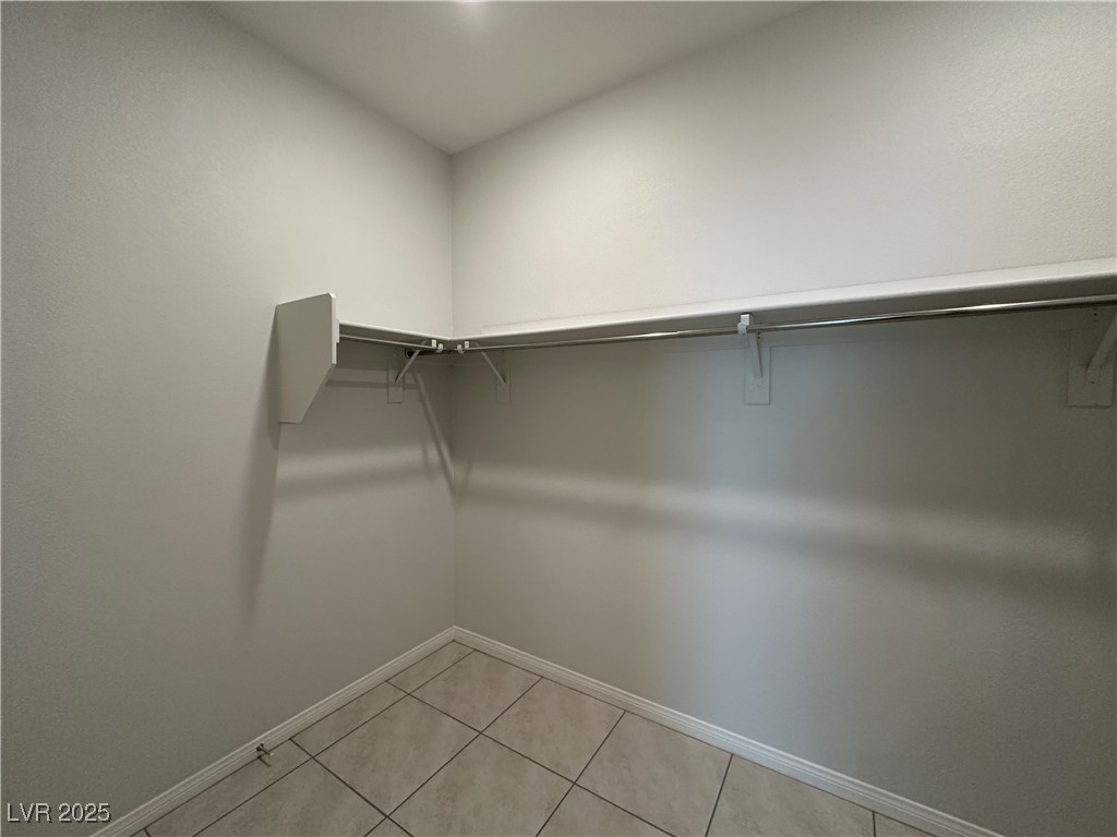 11585 Salt Creek Avenue Las Vegas, NV 89138 - Photo 17 of 45 Walk in closet with light tile patterned floors