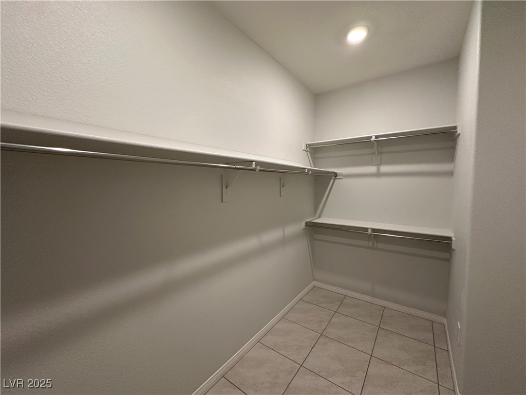 11585 Salt Creek Avenue Las Vegas, NV 89138 - Photo 18 of 45 Spacious closet featuring light tile patterned flooring