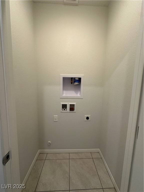 11585 Salt Creek Avenue Las Vegas, NV 89138 - Photo 19 of 45 Laundry area featuring light tile patterned floors, hookup for a washing machine, and hookup for an electric dryer