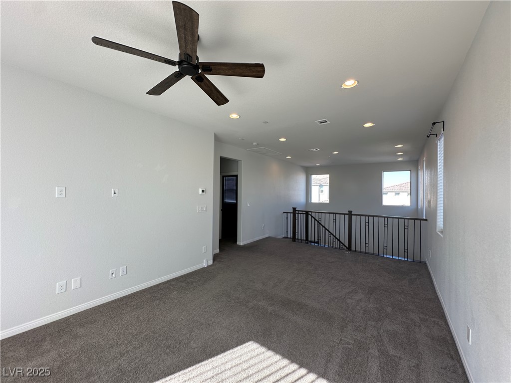 11585 Salt Creek Avenue Las Vegas, NV 89138 - Photo 23 of 45 Spare room featuring recessed lighting, dark colored carpet, and ceiling fan