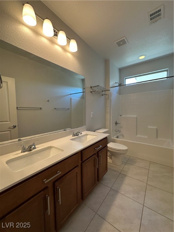 11585 Salt Creek Avenue Las Vegas, NV 89138 - Photo 35 of 45 Full bathroom with double vanity, washtub / shower combination, light tile patterned flooring, and a textured ceiling