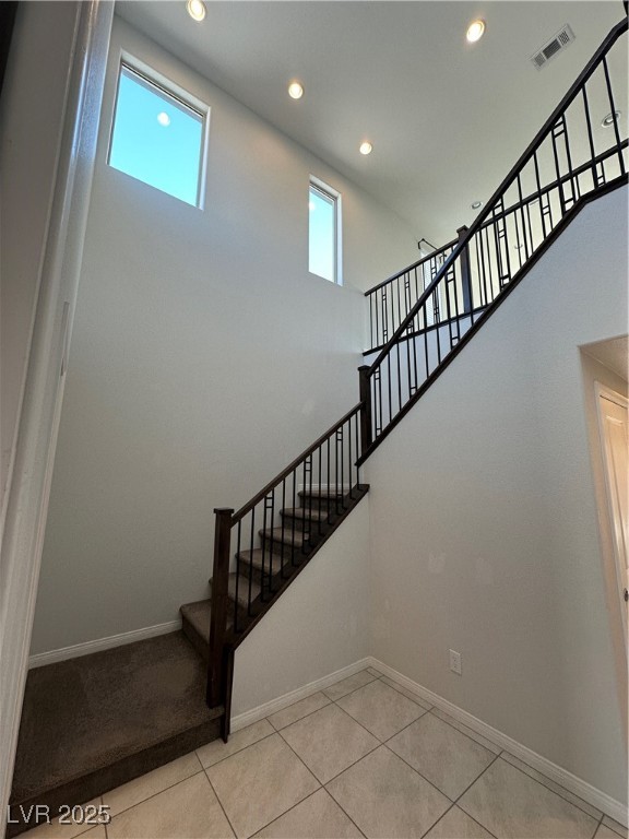 11585 Salt Creek Avenue Las Vegas, NV 89138 - Photo 4 of 45 Staircase with recessed lighting and tile patterned floors