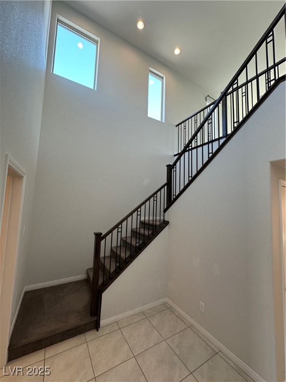 11585 Salt Creek Avenue Las Vegas, NV 89138 - Photo 6 of 45 Stairs featuring a high ceiling, recessed lighting, and tile patterned flooring