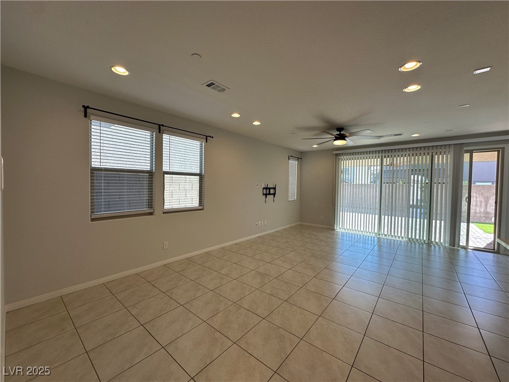 11585 Salt Creek Avenue Las Vegas, NV 89138 - Photo 8 of 45 Unfurnished room featuring plenty of natural light, recessed lighting, light tile patterned floors, and a ceiling fan