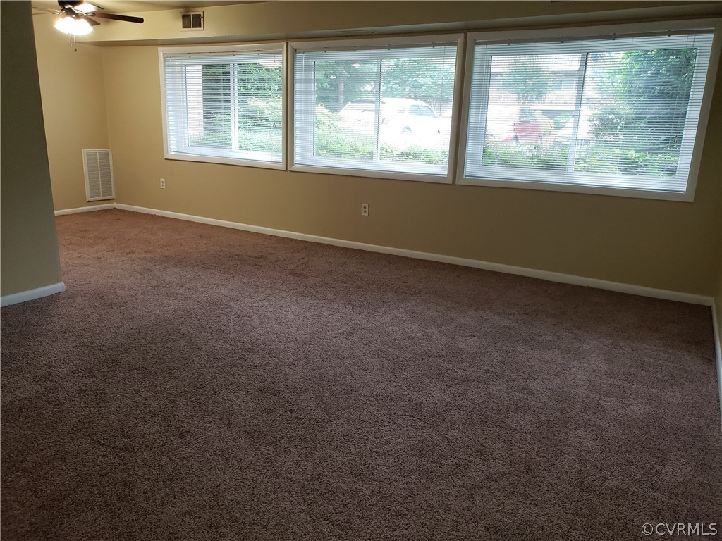 5612 Crenshaw Road, Unit 1113 Richmond, VA 23227 - Photo 13 of 19 an empty room with a window