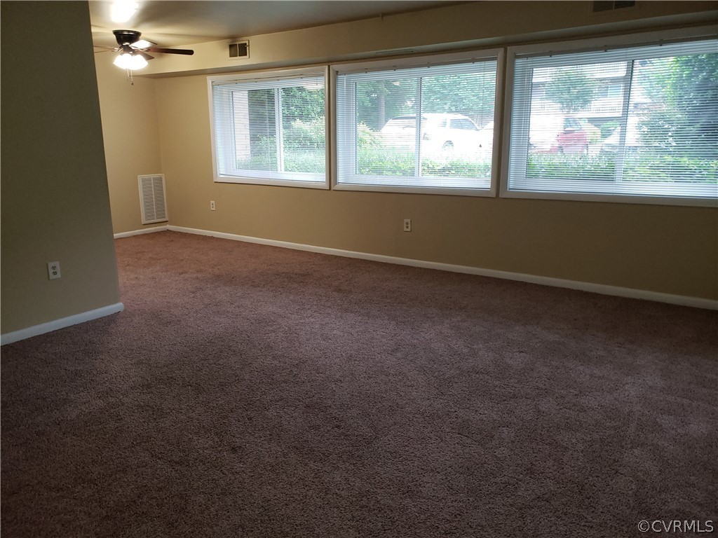 5612 Crenshaw Road, Unit 1113 Richmond, VA 23227 - Photo 14 of 19 an empty room with a window