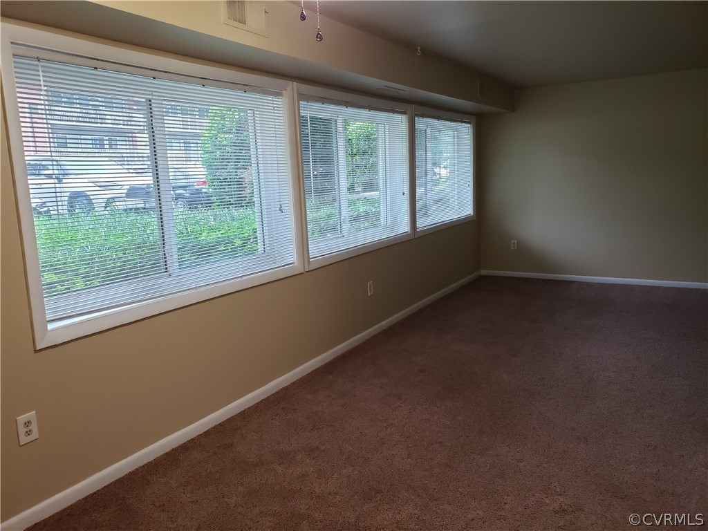 5612 Crenshaw Road, Unit 1113 Richmond, VA 23227 - Photo 3 of 19 a view of an empty room with a window