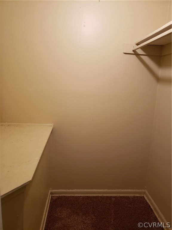 5612 Crenshaw Road, Unit 1113 Richmond, VA 23227 - Photo 9 of 19 a view of a room with racks on the wall