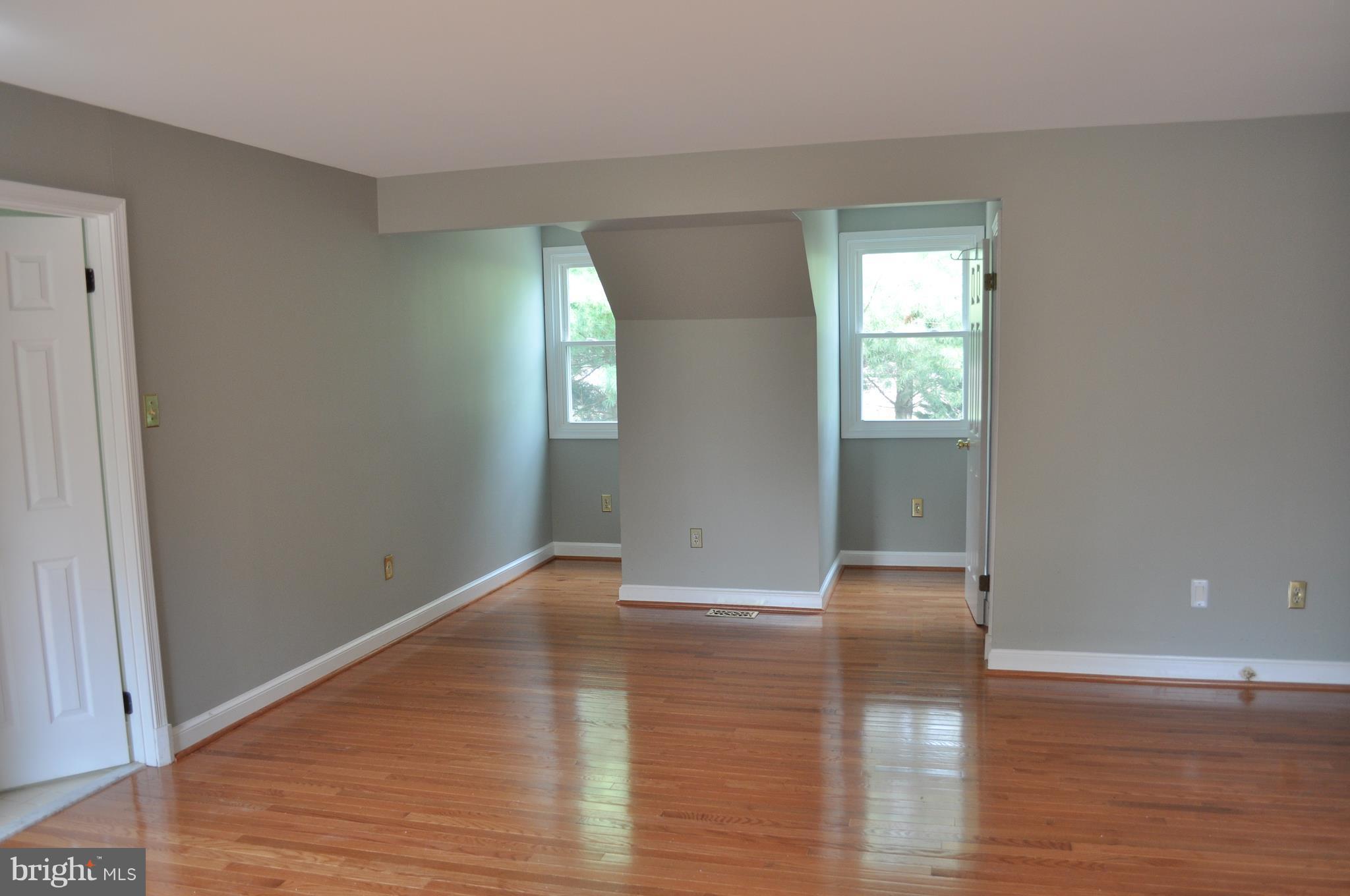 14616 Falling Leaf Way Gaithersburg, MD 20878 - Photo 12 of 23 a view of empty room with wooden floor and fan