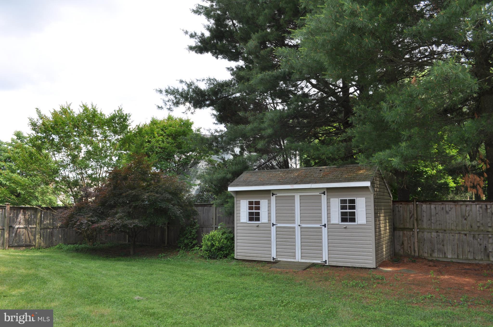 14616 Falling Leaf Way Gaithersburg, MD 20878 - Photo 20 of 23 a view of a house with a yard