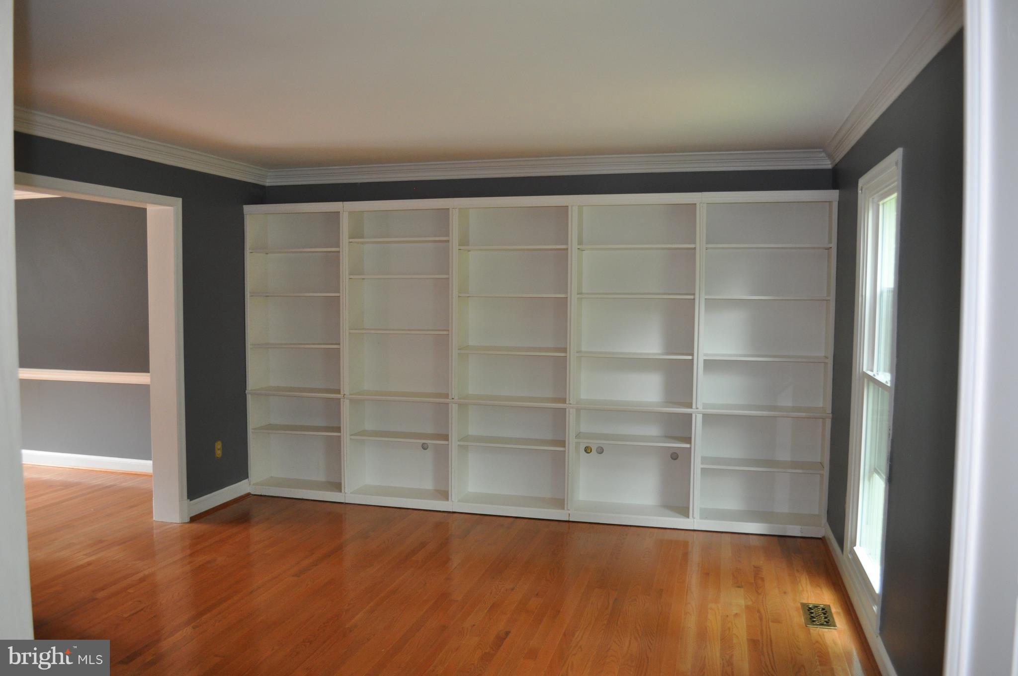 14616 Falling Leaf Way Gaithersburg, MD 20878 - Photo 4 of 23 a view of an empty room with wooden floor and a window