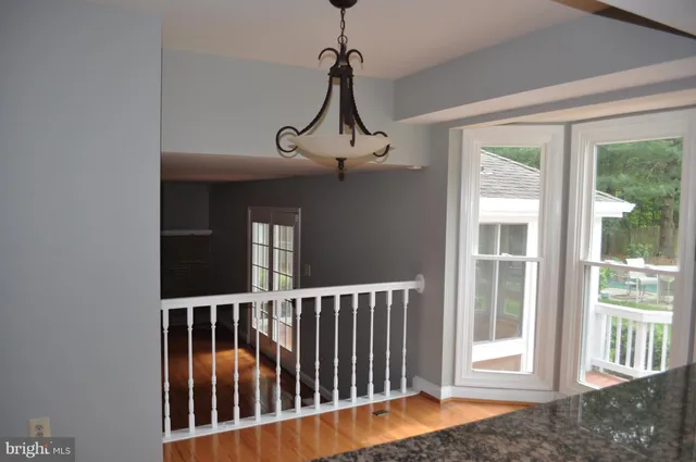a view of a balcony with wooden floor