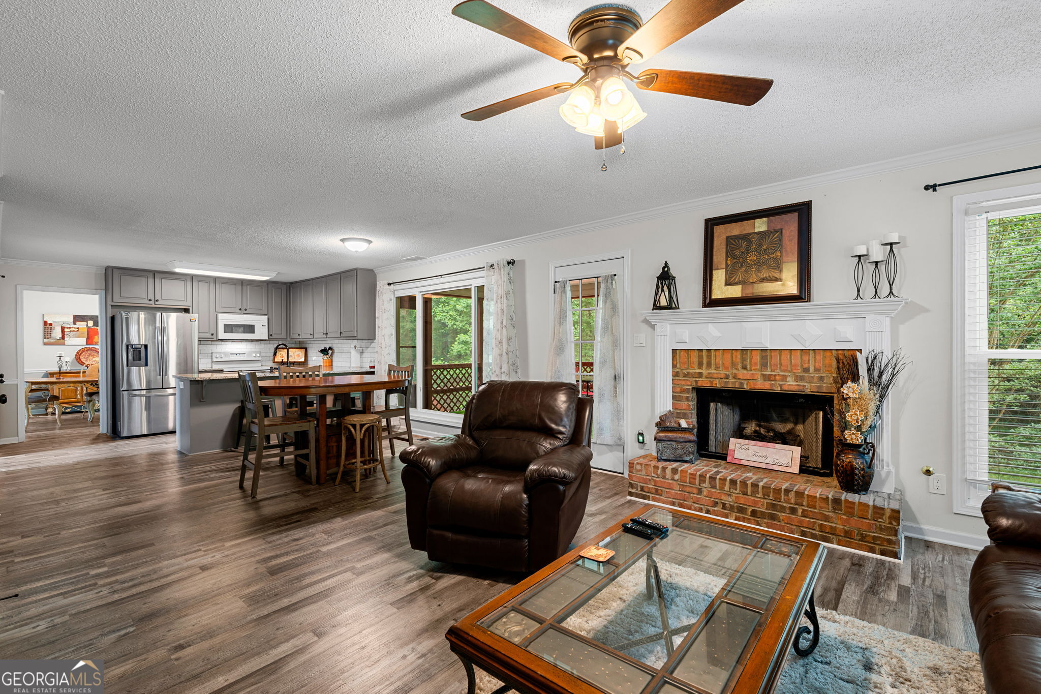 375 Gaelic Way Tyrone, GA 30290 - Photo 18 of 54 a living room with furniture and a fireplace