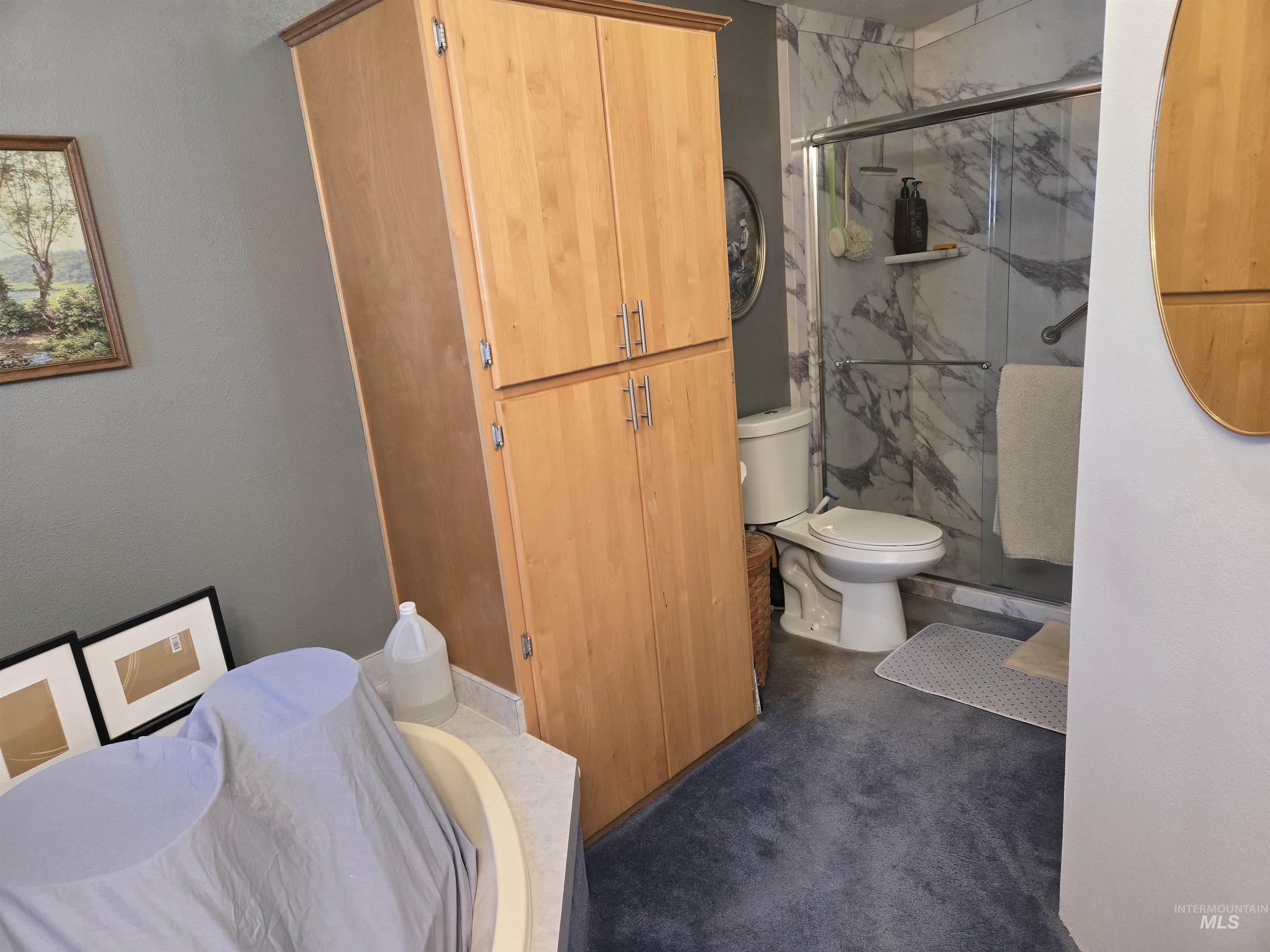 254 Lackey Road Weippe, ID 83553 - Photo 12 of 38 Bathroom with a marble finish shower and a bath