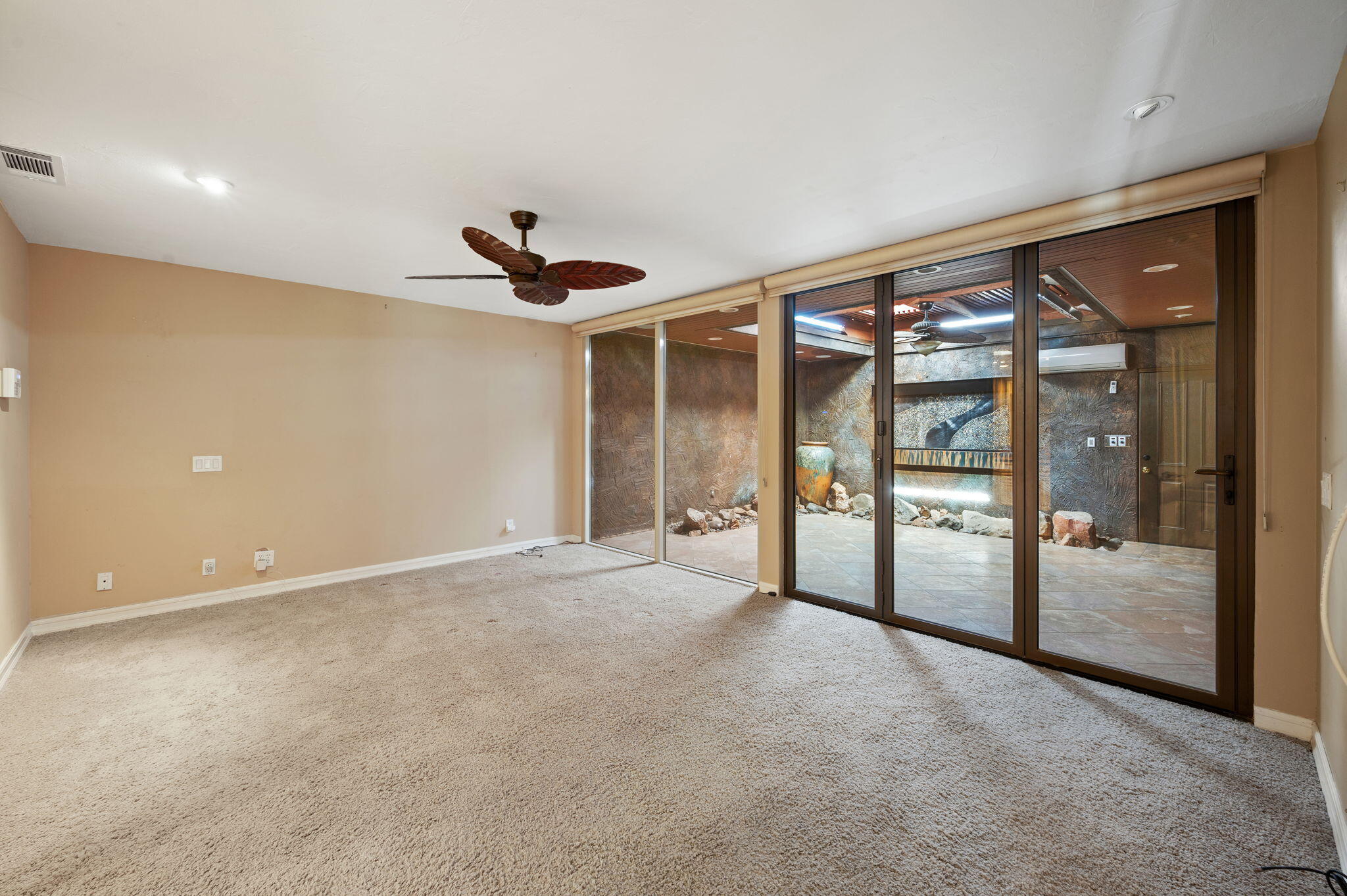 77675 Seminole Road Indian Wells, CA 92210 - Photo 30 of 40 a view of an empty room with glass door