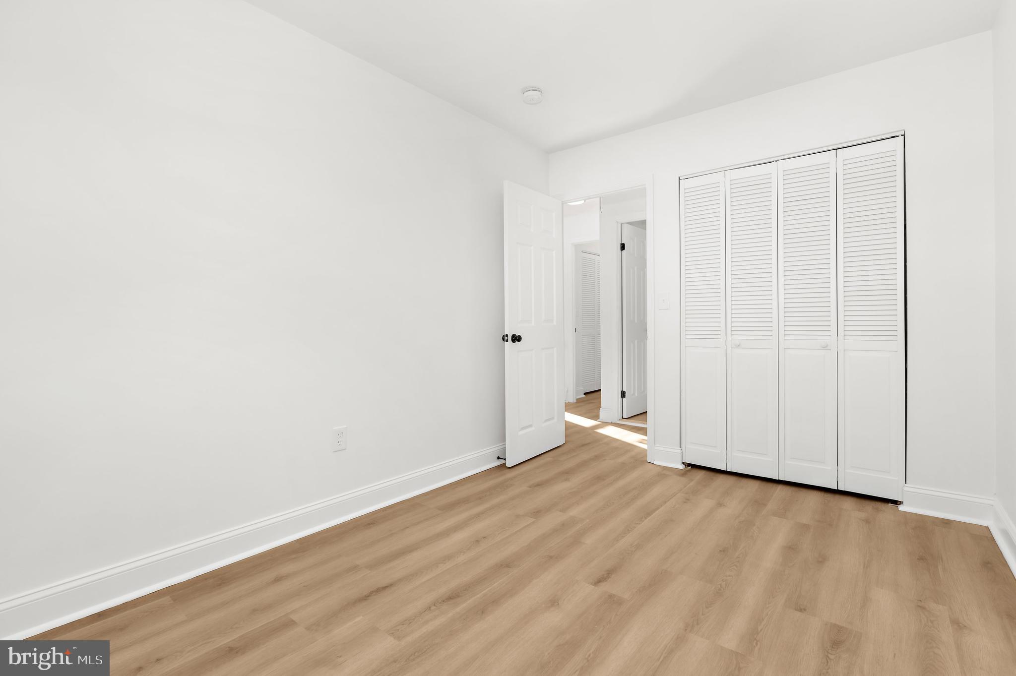 615 Bywater Road Annapolis, MD 21401 - Photo 20 of 28 a view of an empty room with wooden floor
