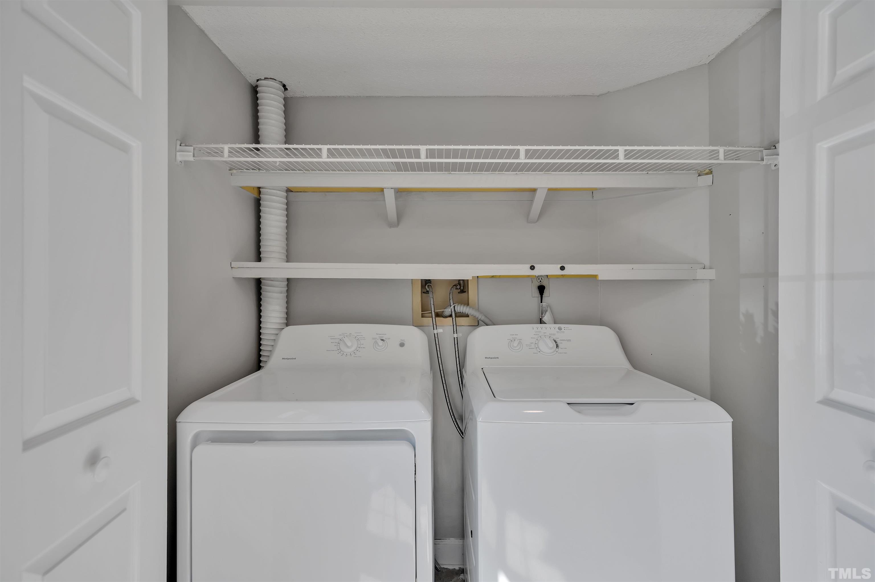 7831 Stephanie Lane Raleigh, NC 27615 - Photo 16 of 17 a utility room with dryer and washer