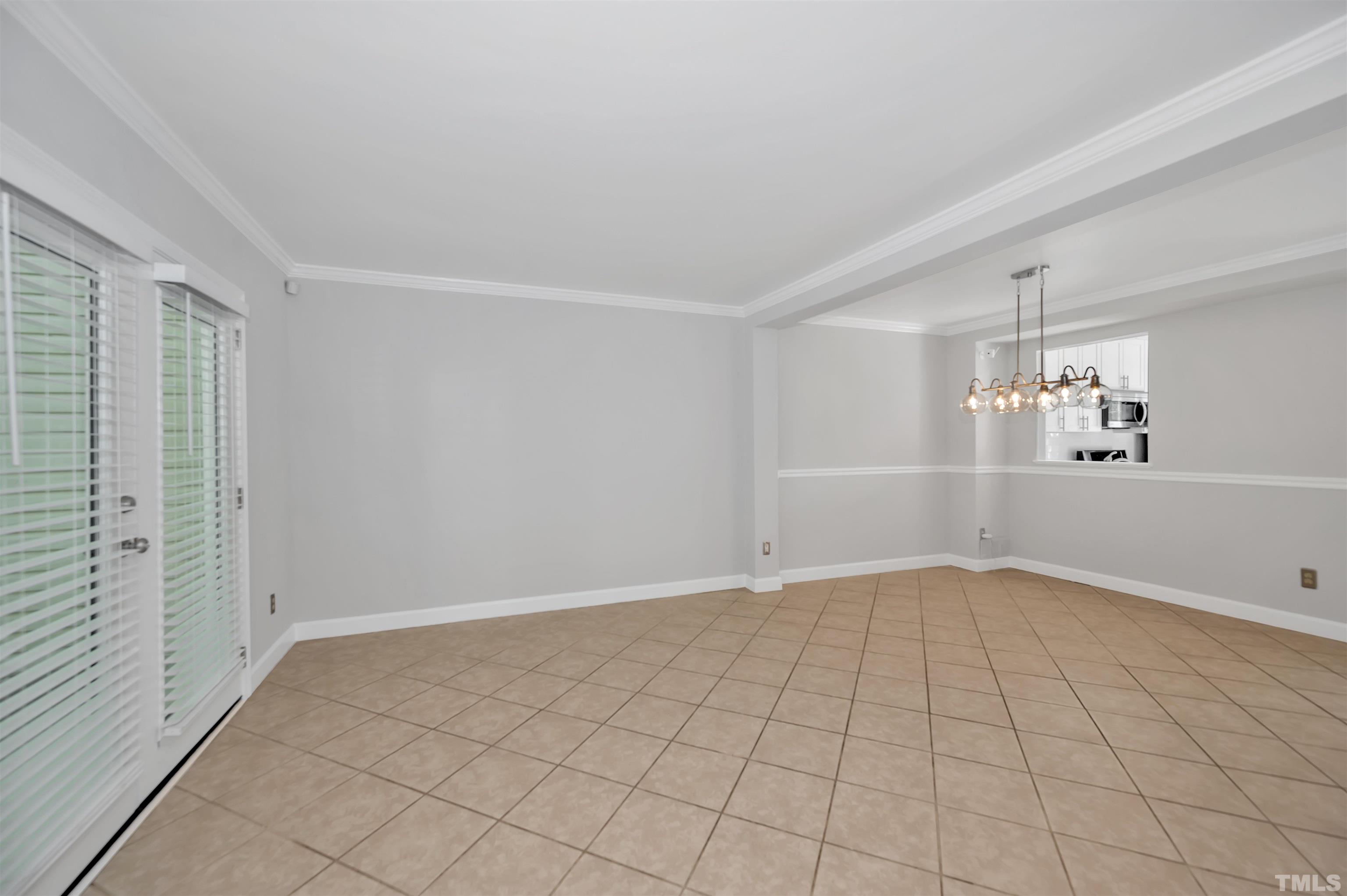 7831 Stephanie Lane Raleigh, NC 27615 - Photo 4 of 17 an empty room with windows
