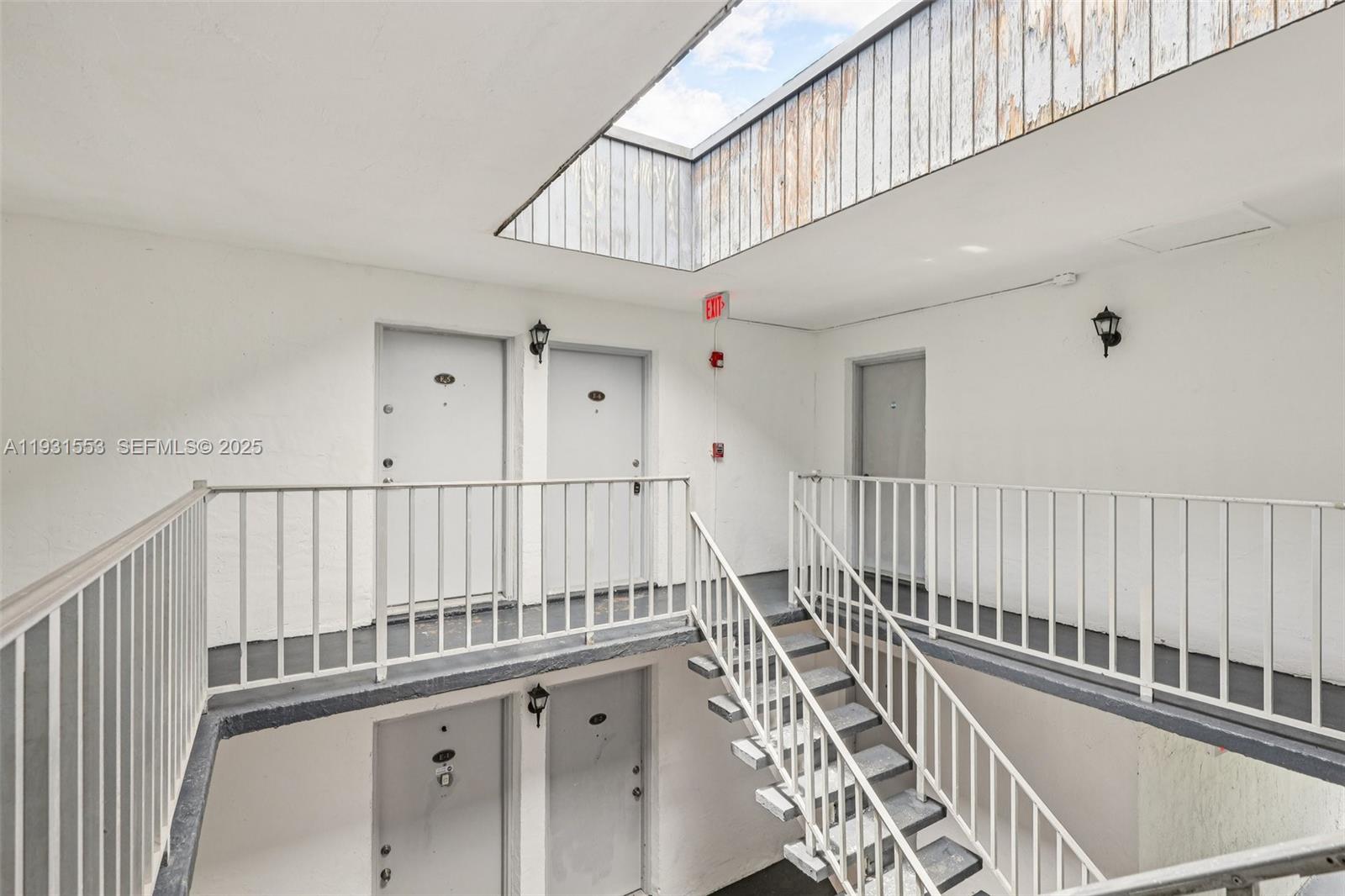 7232 Southwest 94th Place, Unit E6 Miami, FL 33173 - Photo 2 of 31 a view of entryway with wooden floor