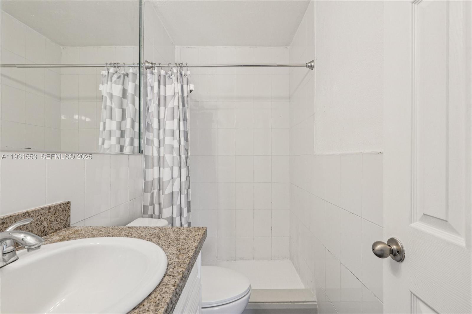 7232 Southwest 94th Place, Unit E6 Miami, FL 33173 - Photo 24 of 31 a bathroom with a sink toilet and shower