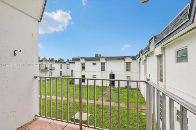 a view of a balcony with an ocean view