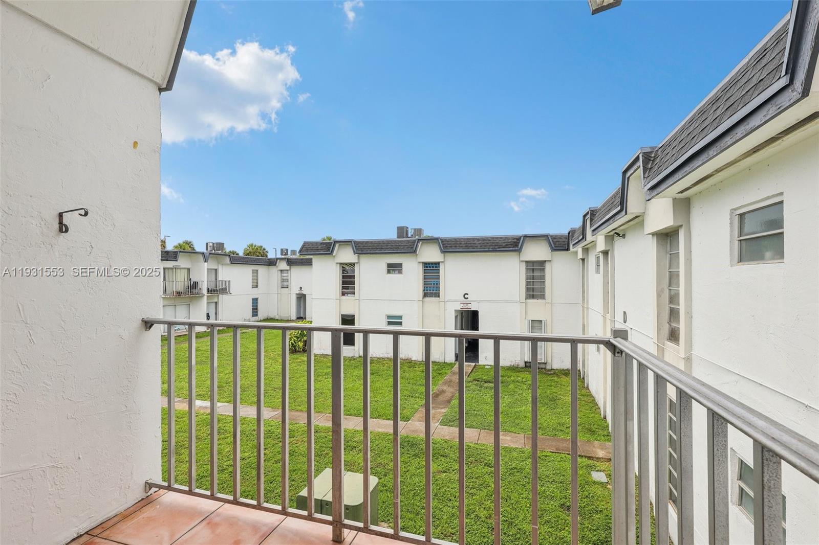 7232 Southwest 94th Place, Unit E6 Miami, FL 33173 - Photo 26 of 31 a view of a balcony with an ocean view