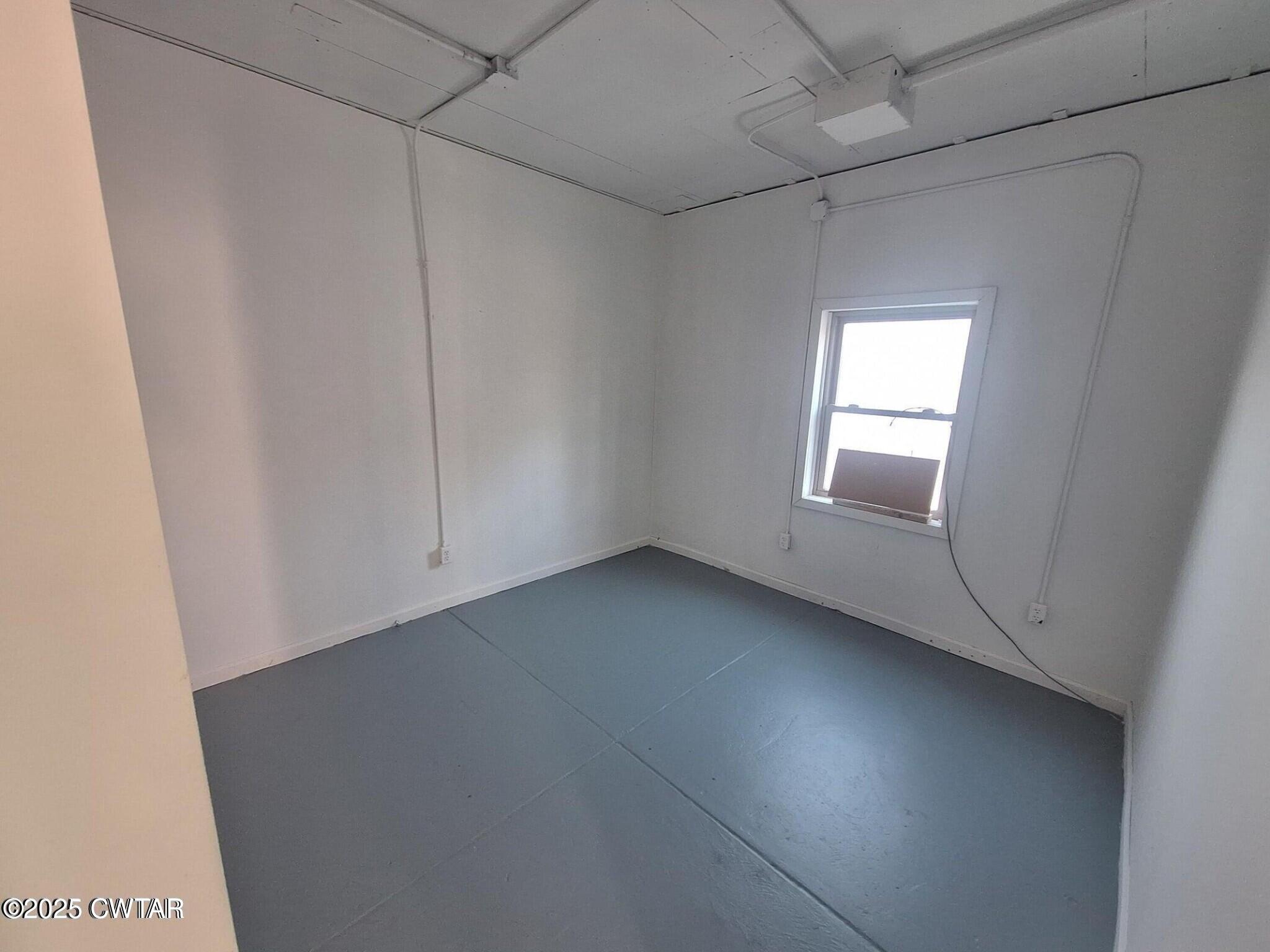 600 Highway 64 Adamsville, TN 38310 - Photo 18 of 25 a view of an empty room with a window