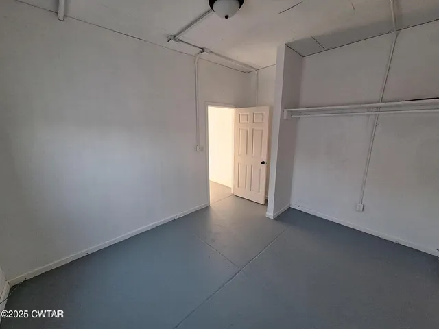 a view of a hallway with staircase