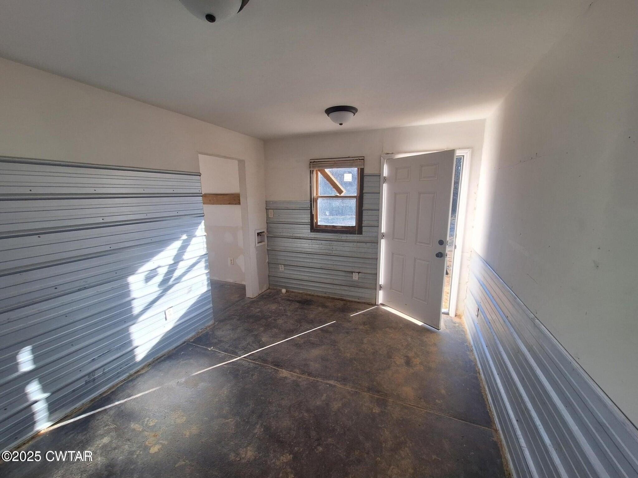 600 Highway 64 Adamsville, TN 38310 - Photo 23 of 25 a view of an empty room and a windows