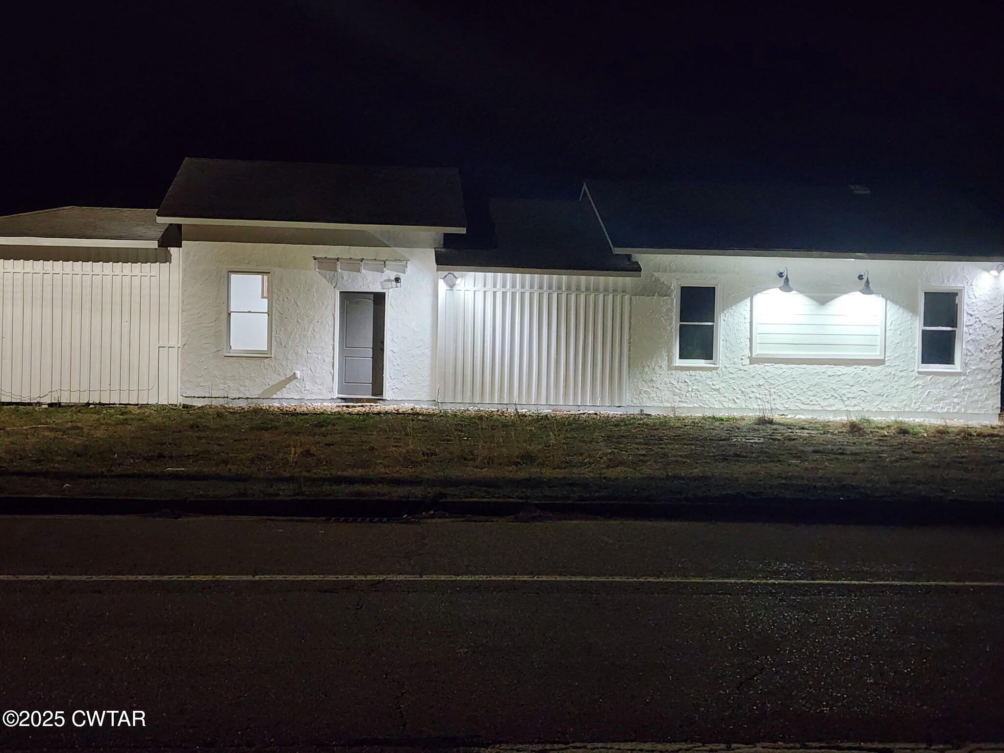600 Highway 64 Adamsville, TN 38310 - Photo 4 of 25 a front view of a house with stairs