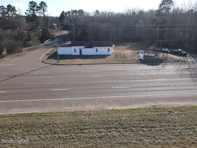a kitchen with a sink and chandelier