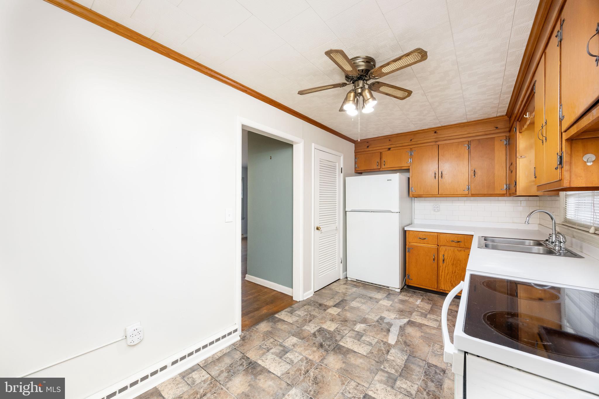 310 Zion Road Salisbury, MD 21804 - Photo 6 of 40 a kitchen with a refrigerator and a sink