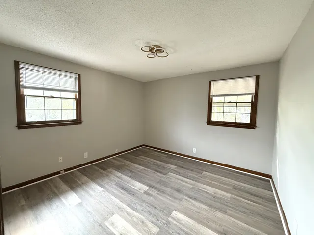 a view of empty room with windows