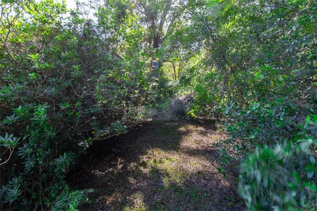 a view of a swimming pool with an outdoor space and seating area