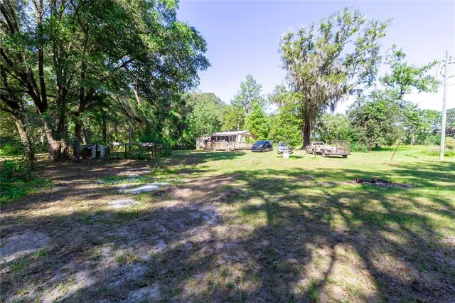 a view of outdoor space with deck and yard