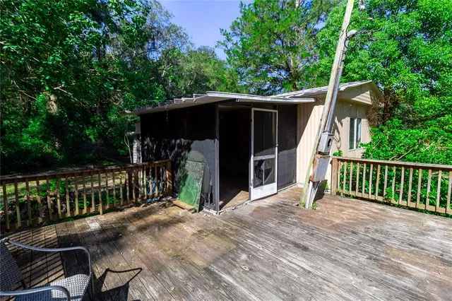 a kitchen with granite countertop a sink a stove and cabinets
