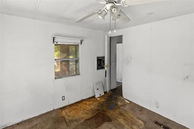a white toilet sitting next to a shower curtain