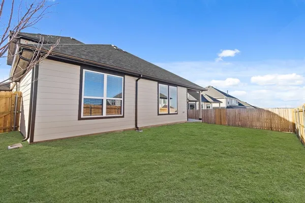 a view of front of house with a yard